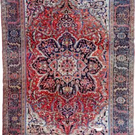alt="Vintage Ahar Heriz carpet with red field and blue floral border" alt="Persian Heriz rug with central medallion and cream spandrels" alt="Northwest Iran rug with stylised floral design and bold medallion" alt="Traditional Heriz carpet from Ahar with red and blue color palette"