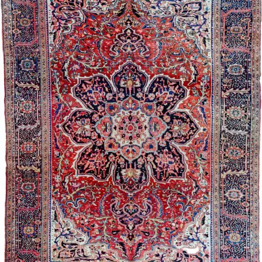 alt="Vintage Ahar Heriz carpet with red field and blue floral border" alt="Persian Heriz rug with central medallion and cream spandrels" alt="Northwest Iran rug with stylised floral design and bold medallion" alt="Traditional Heriz carpet from Ahar with red and blue color palette"