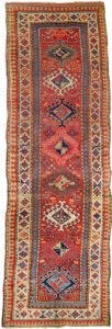 alt="Antique Shahsavan runner with red field and tribal medallions" alt="Persian tribal rug with geometric borders and charming motifs" alt="Long red Shahsavan corridor runner with bold tribal patterns" alt="Vintage Shahsavan runner with slight bend and rich colours"