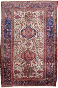 alt="Karaja rug with rare cream ground and multiple medallions" alt="Persian tribal rug with royal blue geometric border and Karaja motifs" alt="Unusual Karaja rug with hidden Serapi weave start" alt="Collector Karaja carpet with cream field and blue border"