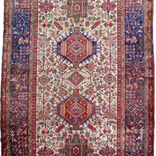 alt="Karaja rug with rare cream ground and multiple medallions" alt="Persian tribal rug with royal blue geometric border and Karaja motifs" alt="Unusual Karaja rug with hidden Serapi weave start" alt="Collector Karaja carpet with cream field and blue border"