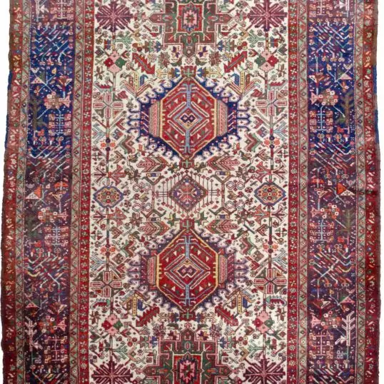 alt="Karaja rug with rare cream ground and multiple medallions" alt="Persian tribal rug with royal blue geometric border and Karaja motifs" alt="Unusual Karaja rug with hidden Serapi weave start" alt="Collector Karaja carpet with cream field and blue border"
