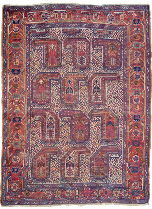 alt="Antique Khamseh rug with rare cream ground and stylised paisley" alt="Qashqai tribal rug from South Iran with terracotta geometric border" alt="Low-pile Persian rug with bush and tree motifs inside paisley design" alt="Vintage cream field Khamseh carpet with earthy tribal patterns"