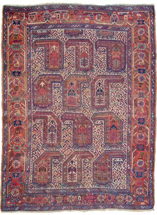 alt="Antique Khamseh rug with rare cream ground and stylised paisley" alt="Qashqai tribal rug from South Iran with terracotta geometric border" alt="Low-pile Persian rug with bush and tree motifs inside paisley design" alt="Vintage cream field Khamseh carpet with earthy tribal patterns"