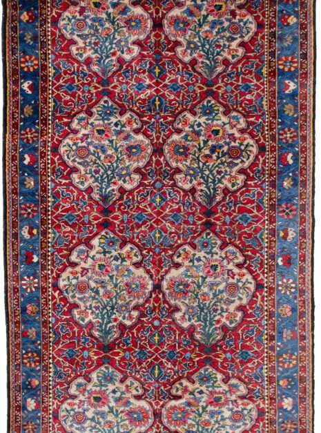 alt="Bakhtiar Faradonbeh rug with Kufic motifs and floral cartouches" alt="Persian rug with red field and cream Kufic design on cartouches" alt="Traditional Bakhtiar rug with light blue floral border" alt="Dining room Persian rug with Islamic and floral design elements"