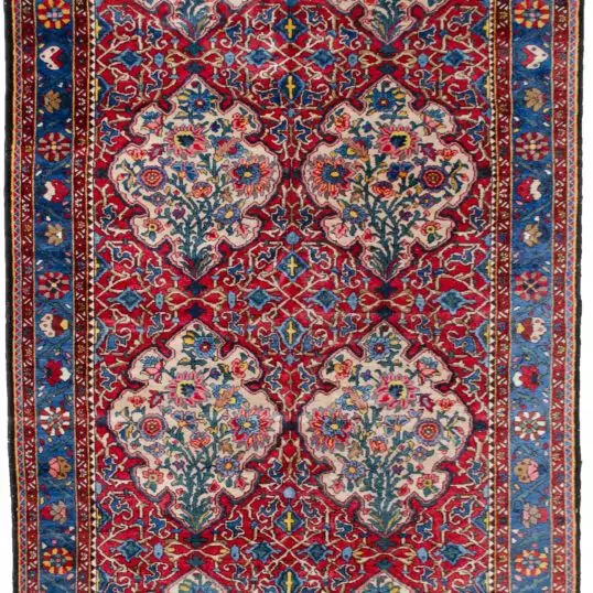 alt="Bakhtiar Faradonbeh rug with Kufic motifs and floral cartouches" alt="Persian rug with red field and cream Kufic design on cartouches" alt="Traditional Bakhtiar rug with light blue floral border" alt="Dining room Persian rug with Islamic and floral design elements"