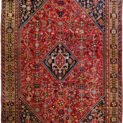 alt="Tribal rug with blue medallion and scarab beetle on terracotta ground" alt="Nomadic Persian rug with symbolic motifs and stylised border" alt="High-quality wool rug with tribal design and missing end knots" alt="Terracotta field tribal carpet with blue medallion and shrub border"