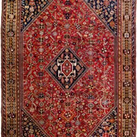 alt="Tribal rug with blue medallion and scarab beetle on terracotta ground" alt="Nomadic Persian rug with symbolic motifs and stylised border" alt="High-quality wool rug with tribal design and missing end knots" alt="Terracotta field tribal carpet with blue medallion and shrub border"