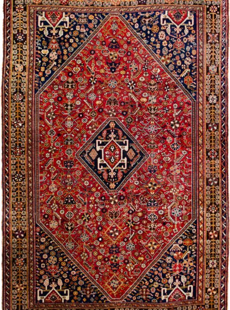 m386-Qashqai-243x167cmr.jpg alt="Tribal rug with blue medallion and scarab beetle on terracotta ground" alt="Nomadic Persian rug with symbolic motifs and stylised border" alt="High-quality wool rug with tribal design and missing end knots" alt="Terracotta field tribal carpet with blue medallion and shrub border"