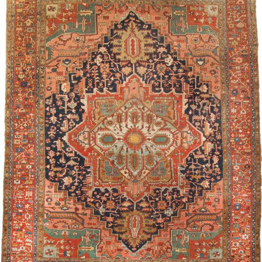 antique-heriz-carpet-blue-background.jpg heriz-carpet-medallion-design.jpg vibrant-spandrels-terracotta-border-heriz.jpg handwoven-heriz-carpet-natural-dyes.jpg