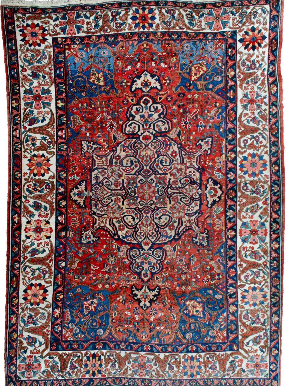 alt="Bakhtiar carpet with terracotta field, blue spandrels, and cream floral border" alt="Hand-knotted Persian rug with medallion and floral motifs from Western Iran" alt="Traditional Bakhtiar carpet with natural dye wool and central medallion design" alt="Persian wool rug featuring terracotta tones and intricate floral borders"