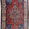 alt="Bakhtiar carpet with terracotta field, blue spandrels, and cream floral border" alt="Hand-knotted Persian rug with medallion and floral motifs from Western Iran" alt="Traditional Bakhtiar carpet with natural dye wool and central medallion design" alt="Persian wool rug featuring terracotta tones and intricate floral borders"