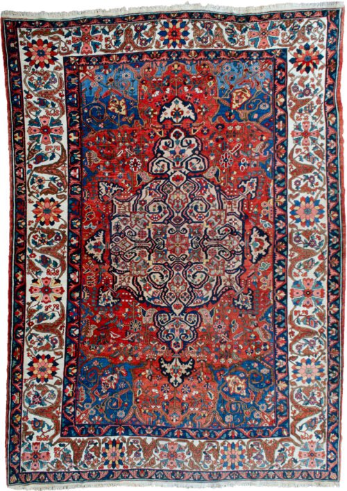 alt="Bakhtiar carpet with terracotta field, blue spandrels, and cream floral border" alt="Hand-knotted Persian rug with medallion and floral motifs from Western Iran" alt="Traditional Bakhtiar carpet with natural dye wool and central medallion design" alt="Persian wool rug featuring terracotta tones and intricate floral borders"