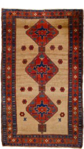 alt="Kordi carpet with camel field and triple medallion design" alt="Persian Kurdish rug with red floral border and blue guard borders" alt="Hand-knotted Kordi rug with flower head motifs and camel background" alt="Traditional Kurdish carpet from Iran with medallions and tribal detailing"