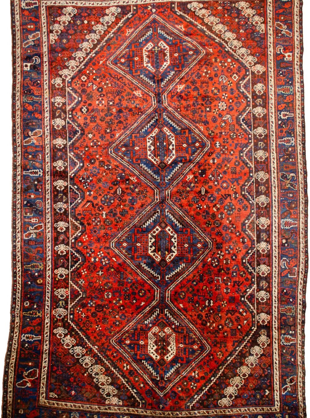 alt="Khamseh tribal rug with burnt oak field and peacock motifs" alt="Handwoven Persian rug with chickens, floral medallions, and paisley border" alt="Southwest Iran tribal rug featuring animal symbols and navy border" alt="Decorative Khamseh rug with intricate medallions and storytelling motifs"