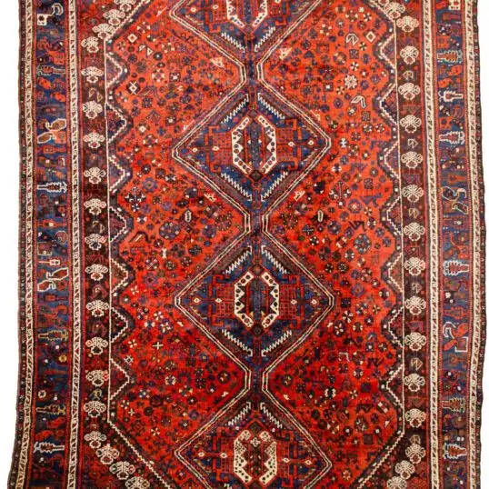 alt="Khamseh tribal rug with burnt oak field and peacock motifs" alt="Handwoven Persian rug with chickens, floral medallions, and paisley border" alt="Southwest Iran tribal rug featuring animal symbols and navy border" alt="Decorative Khamseh rug with intricate medallions and storytelling motifs"
