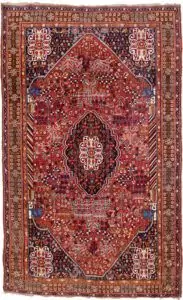 alt="Qashqai rug with deep red field, blue Hashtgol medallion, and Persepolis horse head pillars" alt="Handwoven Persian tribal rug with symbolic motifs and floral spandrels" alt="Qashqai rug featuring Hashtgol motif and paisley flower heads" alt="Decorative Persian rug with blue medallion and brown floral border"
