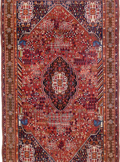 alt="Qashqai rug with deep red field, blue Hashtgol medallion, and Persepolis horse head pillars" alt="Handwoven Persian tribal rug with symbolic motifs and floral spandrels" alt="Qashqai rug featuring Hashtgol motif and paisley flower heads" alt="Decorative Persian rug with blue medallion and brown floral border"
