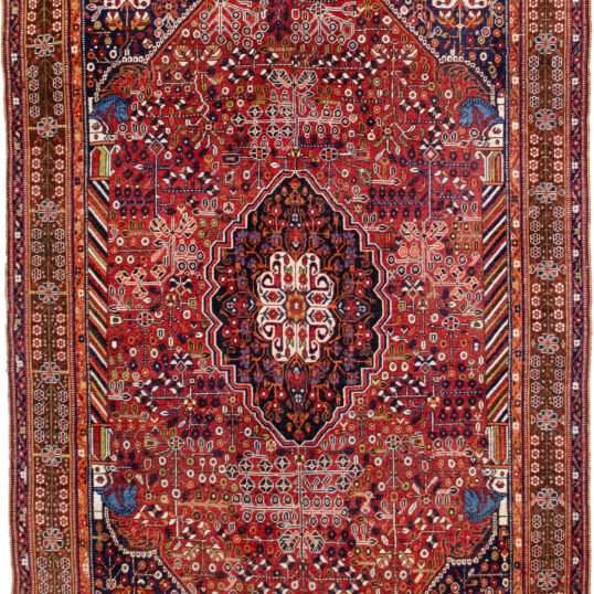 alt="Qashqai rug with deep red field, blue Hashtgol medallion, and Persepolis horse head pillars" alt="Handwoven Persian tribal rug with symbolic motifs and floral spandrels" alt="Qashqai rug featuring Hashtgol motif and paisley flower heads" alt="Decorative Persian rug with blue medallion and brown floral border"