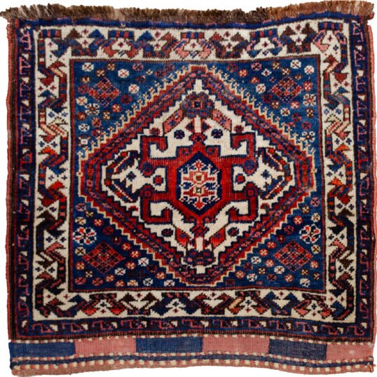 alt="Qashqai kilim bag with light blue background and cream medallion" alt="Tribal Persian bag with scarab beetle motif and floral kilim design" alt="Handwoven Qashqai bag featuring blue field and symbolic medallion" alt="Vintage Qashqai kilim with cream border and central scarab motif"