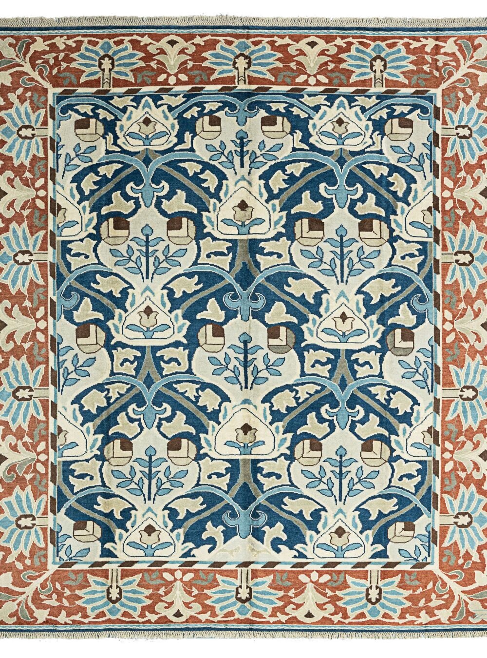 alt="Hand-knotted William Morris inspired rug with blue floral design and squarish format" alt="Arts and Crafts movement carpet with floral motifs and natural dyes" alt="Blue field William Morris style rug with heirloom craftsmanship" alt="William Morris carpet reproduction with Turkish knot and floral border"