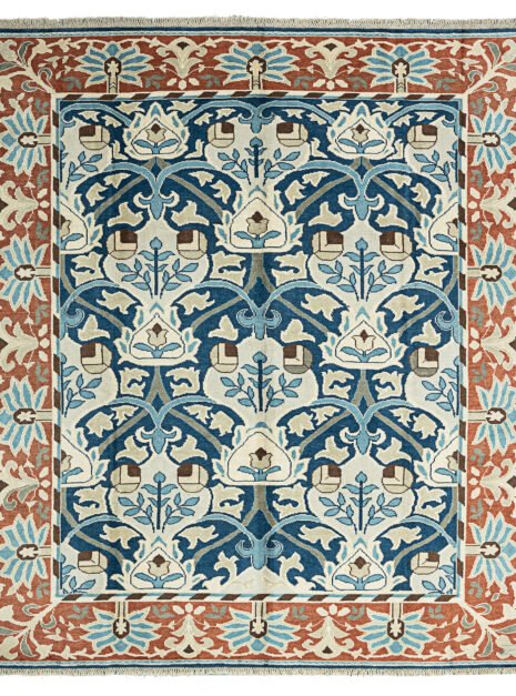 alt="Hand-knotted William Morris inspired rug with blue floral design and squarish format" alt="Arts and Crafts movement carpet with floral motifs and natural dyes" alt="Blue field William Morris style rug with heirloom craftsmanship" alt="William Morris carpet reproduction with Turkish knot and floral border"