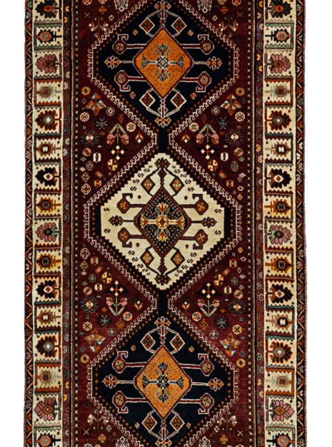 alt="Hand-knotted Qashqai tribal runner with scarab medallions and tribal motifs" alt="Burgundy Qashqai runner with cream floral border and tribal designs" alt="Qashqai runner with rich burgundy background and intricate tribal motifs" alt="Rare Qashqai runner featuring scarab medallions and nature-inspired border"