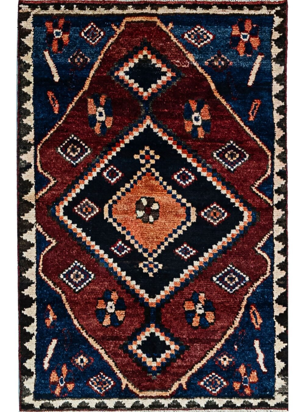 alt="Hand-knotted Bakhtiari Gabbeh rug with lozenge medallion and floral motifs" alt="Deep red Bakhtiari Gabbeh carpet with blue and orange lozenge design" alt="Persian Gabbeh rug with flower head medallion and intricate floral patterns" alt="Traditional Bakhtiari Gabbeh runner with jagged border and rich colors"