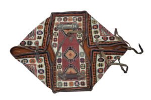 alt="Vintage Qashqai Mafrash with handwoven kilim and original leather straps" alt="Tribal storage chest from southern Iran with geometric kilim motifs" alt="Authentic Qashqai Mafrash used for bedding storage with decorative patterns" alt="Persian nomadic textile box featuring vibrant tribal weaving and leather handles"