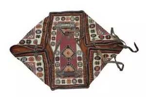 alt="Vintage Qashqai Mafrash with handwoven kilim and original leather straps" alt="Tribal storage chest from southern Iran with geometric kilim motifs" alt="Authentic Qashqai Mafrash used for bedding storage with decorative patterns" alt="Persian nomadic textile box featuring vibrant tribal weaving and leather handles"