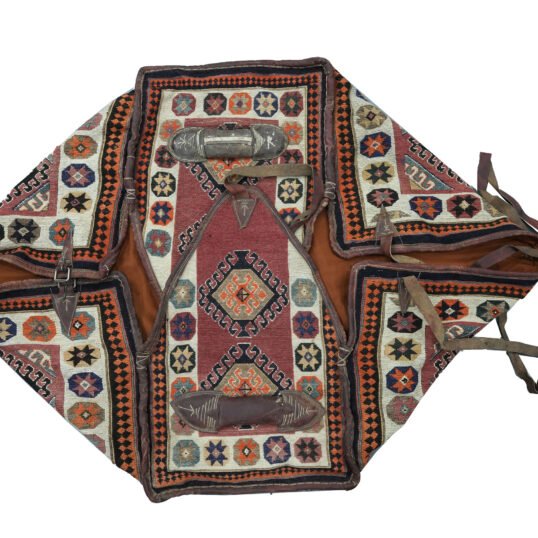 alt="Vintage Qashqai Mafrash with handwoven kilim and original leather straps" alt="Tribal storage chest from southern Iran with geometric kilim motifs" alt="Authentic Qashqai Mafrash used for bedding storage with decorative patterns" alt="Persian nomadic textile box featuring vibrant tribal weaving and leather handles"
