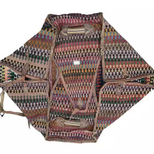 alt="Antique Qashqai Mafrash with kilim panels and leather straps" alt="Persian tribal storage chest with geometric kilim motifs" alt="Handwoven Qashqai bedding bag with vibrant tribal designs" alt="Qashqai Mafrash used as decorative storage trunk with original handles"