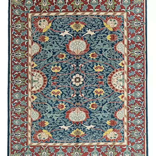 alt="Hand-knotted William Morris Holland Park carpet with vibrant floral motifs and deep red background" alt="Arts and Crafts rug with floral design, inspired by William Morris" alt="Handmade William Morris rug featuring large flower heads and flowing stems" alt="William Morris-inspired floral rug with red background and intricate details"