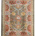 alt="Ushak carpet with taupe background, light blue floral design, and red border" alt="Hand-knotted wool rug with Donegal-inspired asymmetry and botanical motifs" alt="Taupe and red Ushak rug with flowing flower heads and natural dye palette" alt="Artisan-crafted carpet with floral Donegal design in soft and bold tones"