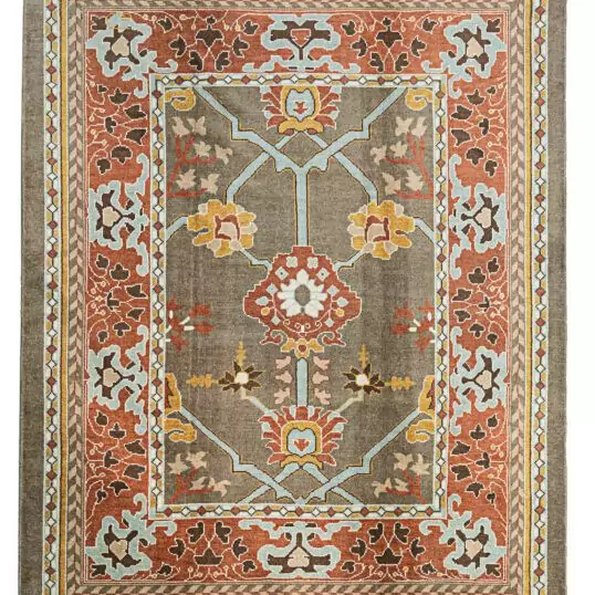 alt="Ushak carpet with taupe background, light blue floral design, and red border" alt="Hand-knotted wool rug with Donegal-inspired asymmetry and botanical motifs" alt="Taupe and red Ushak rug with flowing flower heads and natural dye palette" alt="Artisan-crafted carpet with floral Donegal design in soft and bold tones"
