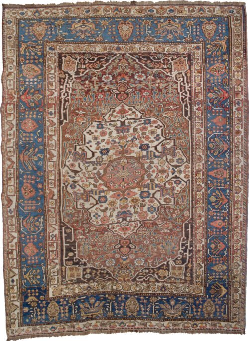 alt="Vintage Khamseh rug with cream medallion and floral motifs on reddish-brown field" alt="Persian carpet with cypress tree border and Bakhtiari-influenced design" alt="Handwoven squarish Khamseh rug with blue border and beige field" alt="Unique Persian rug with geometric guard borders and soft floral elements"