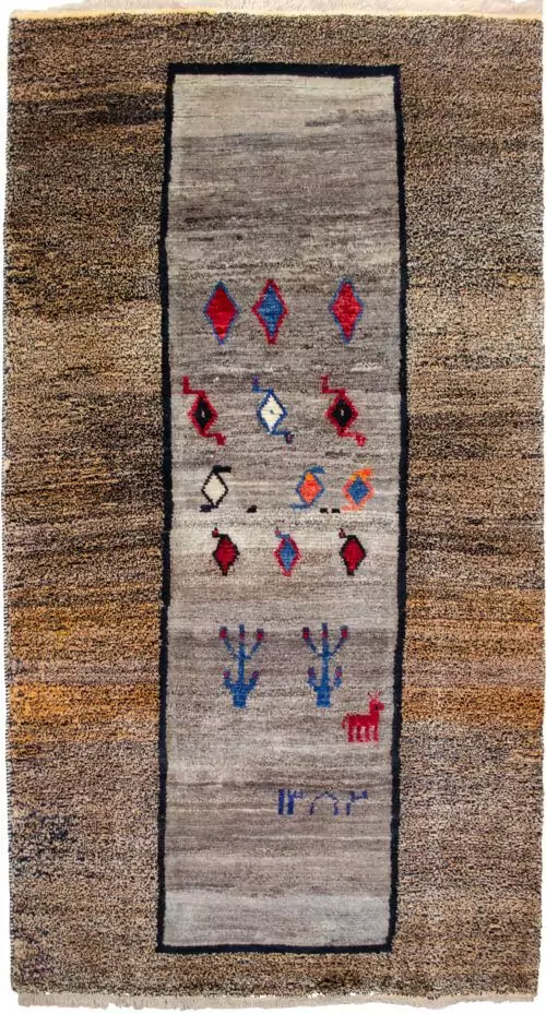 alt="Tribal Gabbeh rug with grey field and horse motif, dated 2003" alt="Stylized bush design in vintage Gabbeh with salt-and-pepper border" alt="Handwoven Iranian Gabbeh with tribal symbols and grey tones" alt="22-year-old Gabbeh rug featur