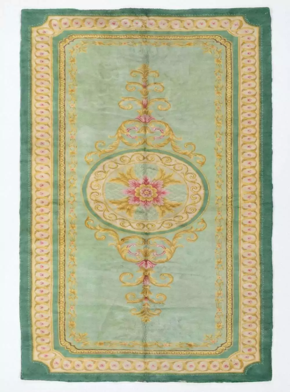 A full, direct overhead view of the Hand-Knotted Vintage Spanish Rug 1950s Deep Green against a white background. This shot clearly displays the 639 x 295cm dimensions, the central floral medallion, the light green field, and the thick, ornate dark green border with gold detailing.
