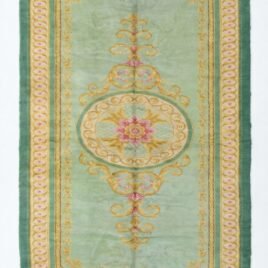 A full, direct overhead view of the Hand-Knotted Vintage Spanish Rug 1950s Deep Green against a white background. This shot clearly displays the 639 x 295cm dimensions, the central floral medallion, the light green field, and the thick, ornate dark green border with gold detailing.