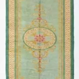 A full, direct overhead view of the Hand-Knotted Vintage Spanish Rug 1950s Deep Green against a white background. This shot clearly displays the 639 x 295cm dimensions, the central floral medallion, the light green field, and the thick, ornate dark green border with gold detailing.