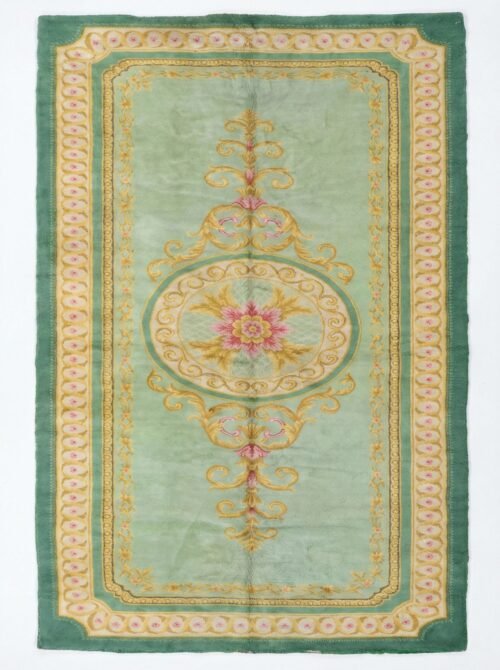 A full, direct overhead view of the Hand-Knotted Vintage Spanish Rug 1950s Deep Green against a white background. This shot clearly displays the 639 x 295cm dimensions, the central floral medallion, the light green field, and the thick, ornate dark green border with gold detailing.