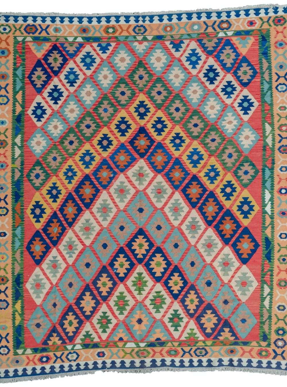 alt="Vintage Anbaran kilim with deep red background and colorful lozenge design" alt="Persian flatweave rug with beige and green borders from Anbaran, Iran" alt="Handwoven Iranian kilim with geometric lozenge motifs" alt="Traditional Anbaran kilim rug showcasing rich colors and intricate patterns"